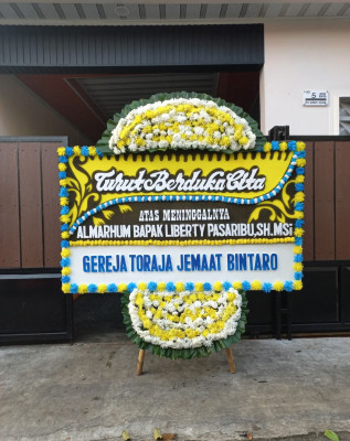 Papan Bunga Duka di Guwosari